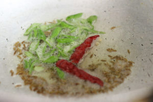 tempering with curry leaves for spinach dal recipe