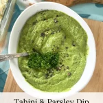 tahini and parsley dip with fresh curly parsley